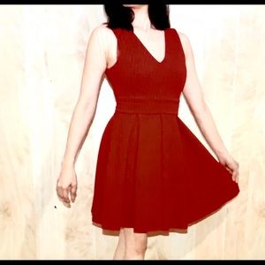 Red V-neck dress.
